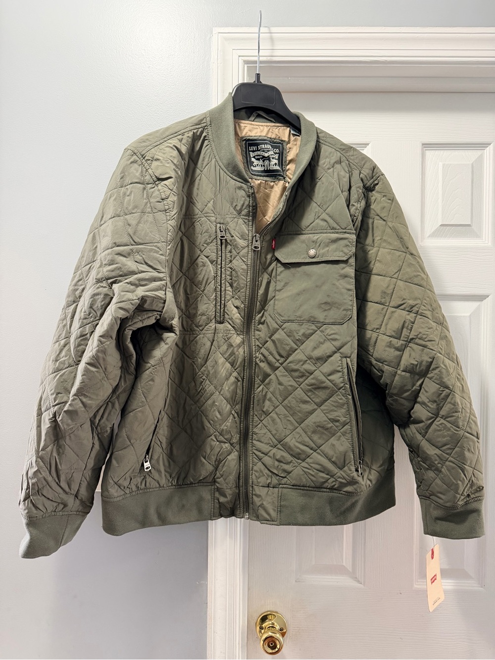 Levi’s Olive Green diamond pattern bomber jacket with zipper